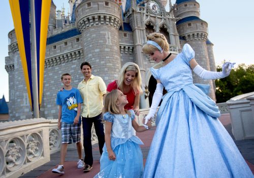 Cinderella and family at Cinderella Castle at Magic Kingdom Park © Disney